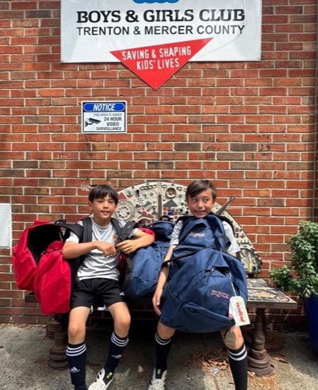 Students donating school supplies